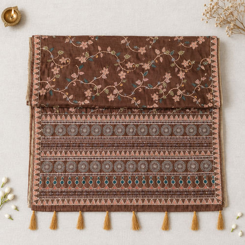 Brown saree with open pallu on off-white linen