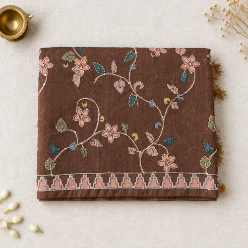 Folded brown saree on off-white linen